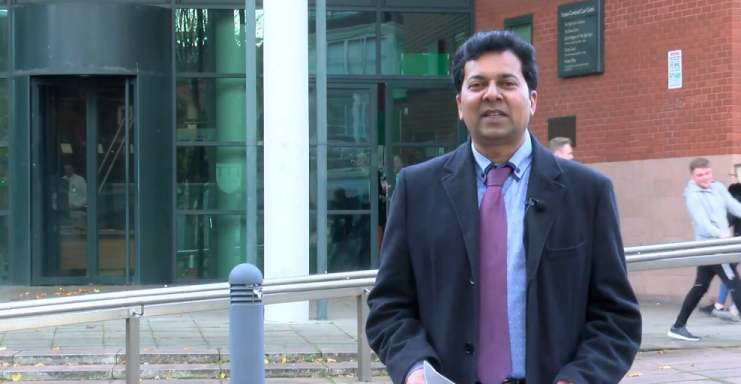 Muhammad Farhan Aslam reporting on camera outside Preston Crown Court.