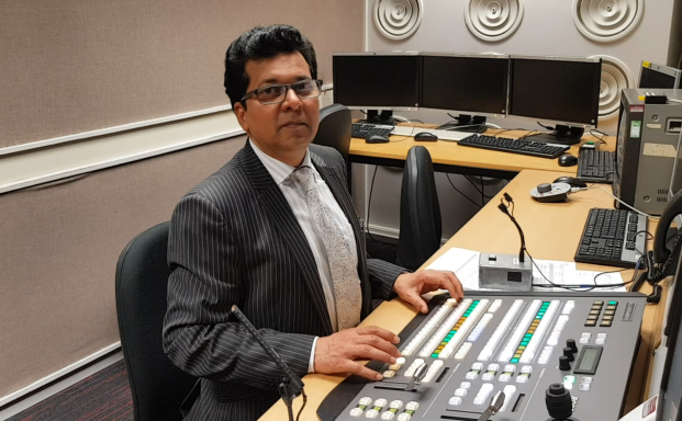 Muhammad Farhan Aslam directing news from the TV control room at the University of Central Lancashire.