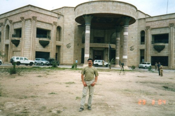 Muhammad Farhan Aslam standing outside Saddam Hussein’s palace near the Shatt Al-Arab River in Basra, Iraq.