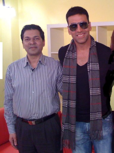 Muhammad Farhan Aslam with actor Akshay Kumar on the set of Sunrise TV London.