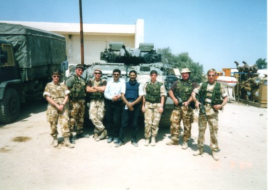 Muhammad Farhan Aslam with a British Army security team in Iraq during the Gulf War 2.